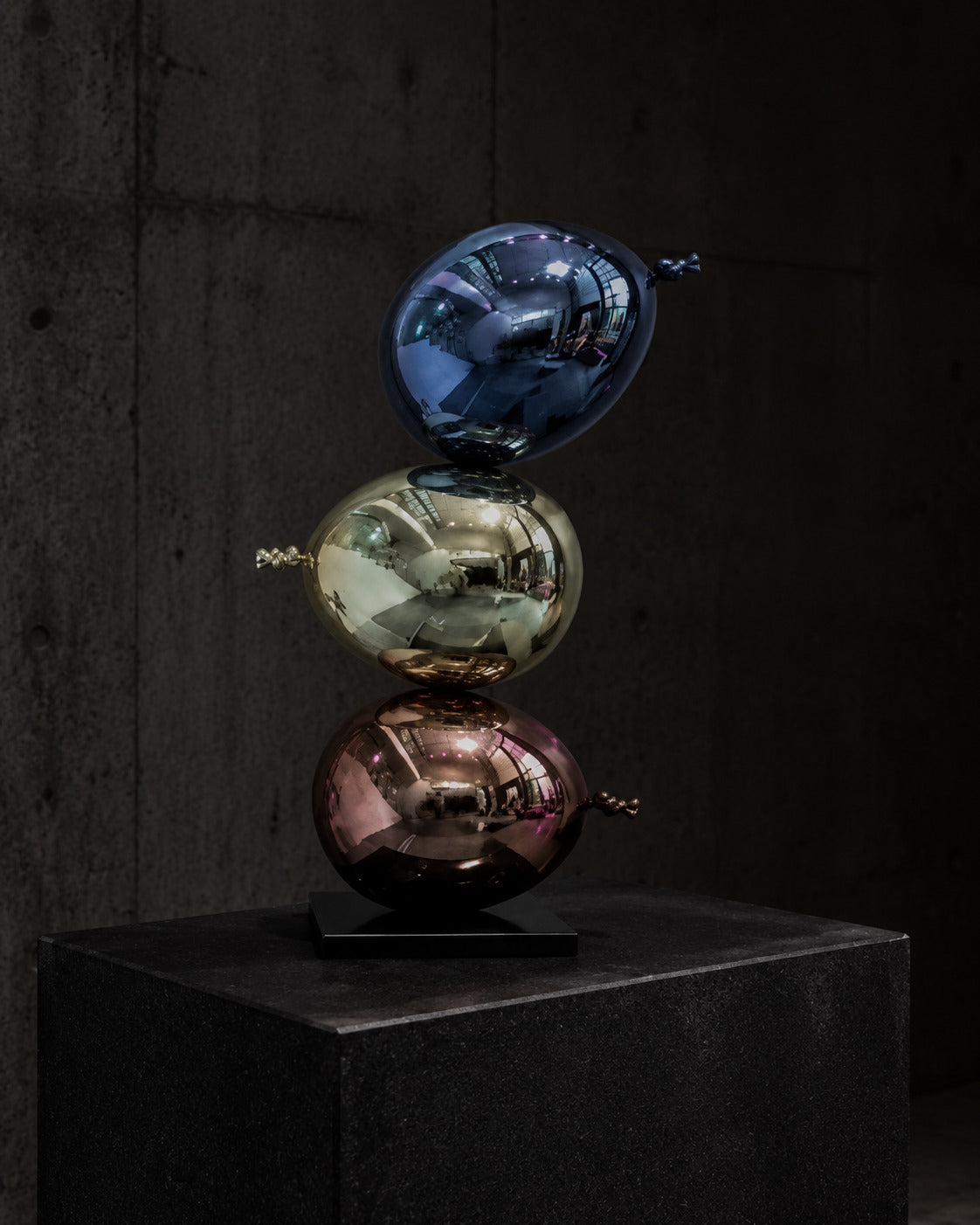 ORBIT STACK — Drop 030 three-orb sculptural object in a dark gallery