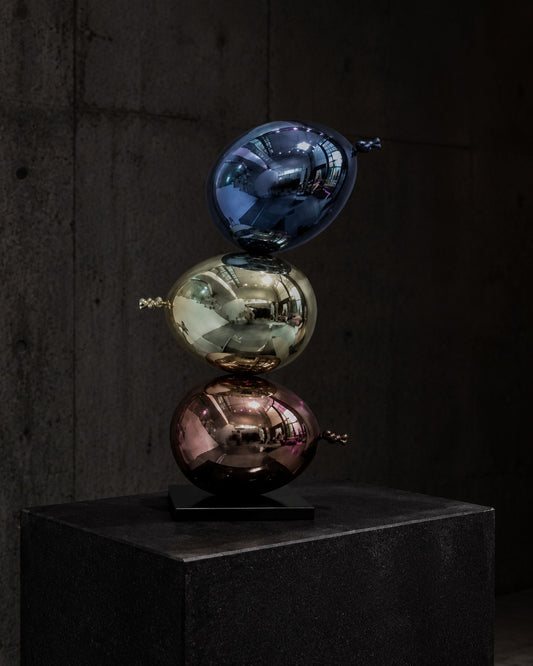 ORBIT STACK — Drop 030 three-orb sculptural object in a dark gallery